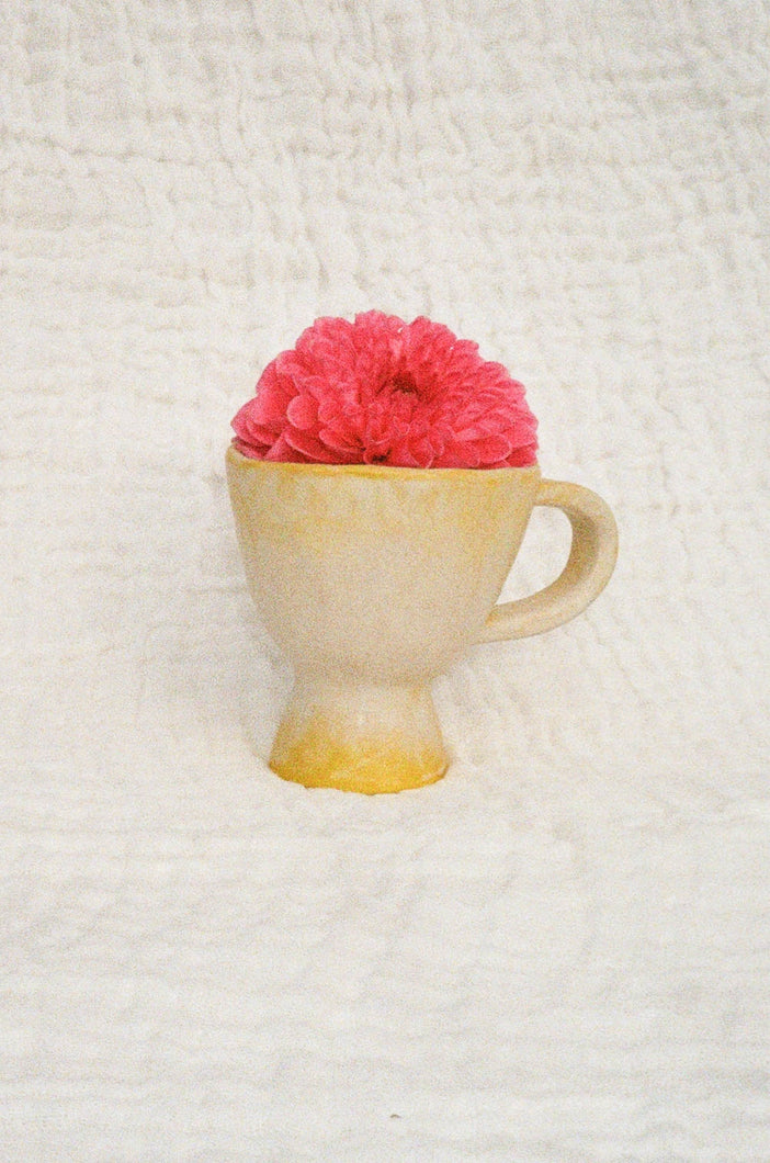 handmade smooth ceramic mug in hues of yellow