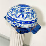 White and blue dried hollowed gourd serving bowl