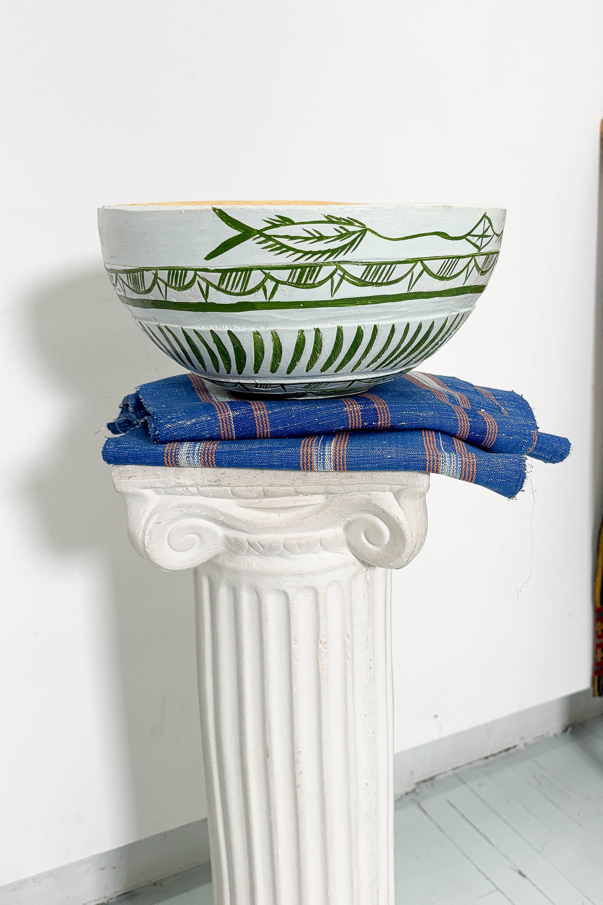 White and green dried hollowed gourd serving bowl