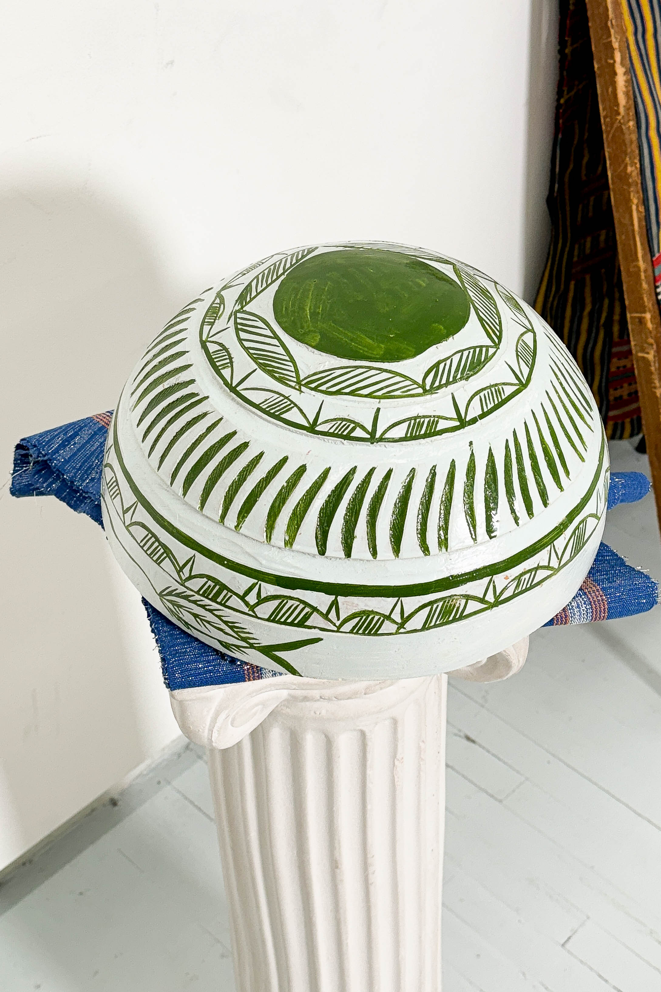 White and green dried hollowed gourd serving bowl