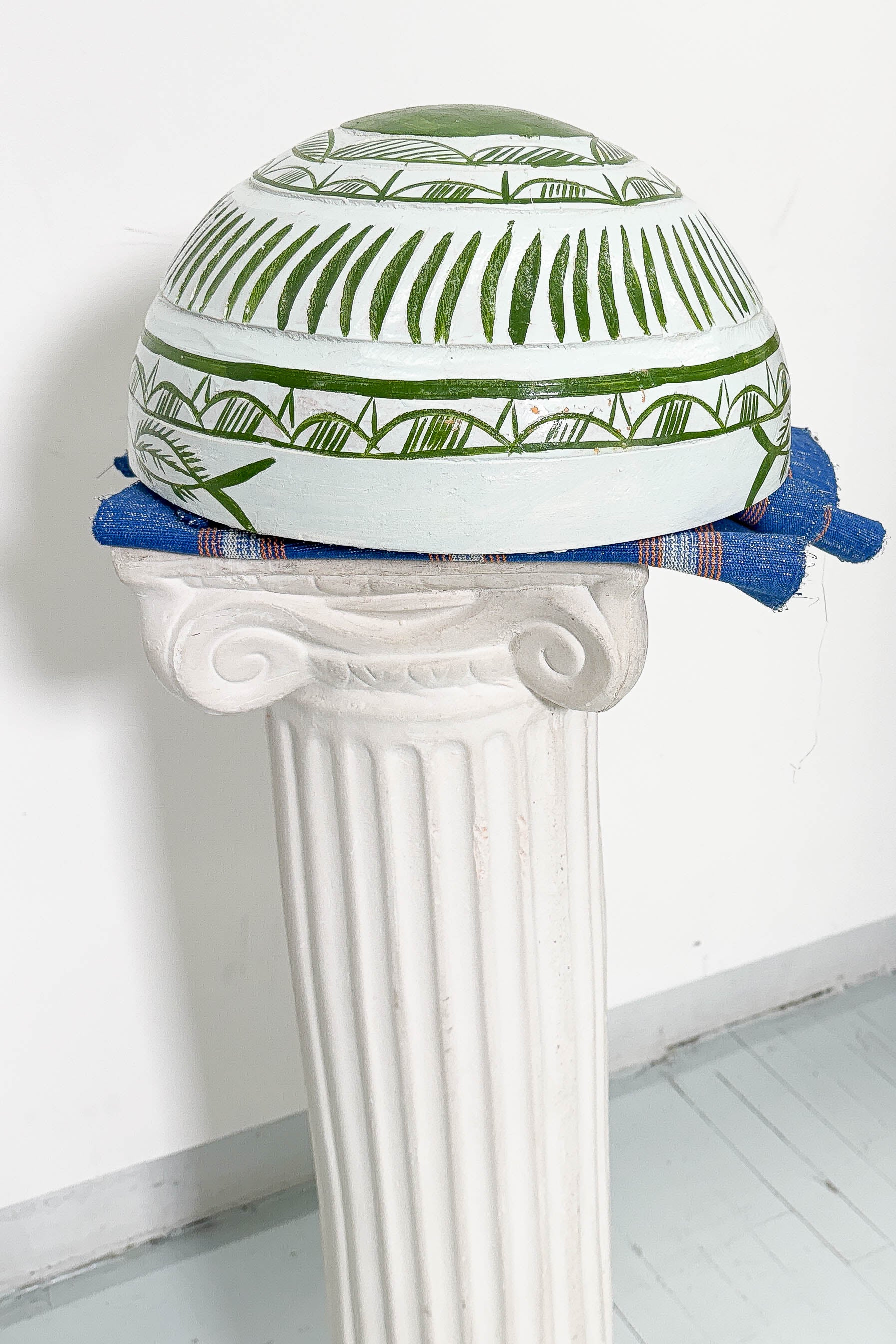 White and green dried hollowed gourd serving bowl