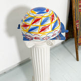 White, blue, red, and yellow dried hollowed gourd serving bowl