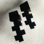 black glass beaded geometric cross earrings