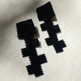 black glass beaded geometric cross earrings