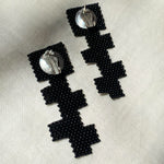 black glass beaded geometric cross earrings