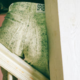 white cotton green ink splatter stove pipe jeans