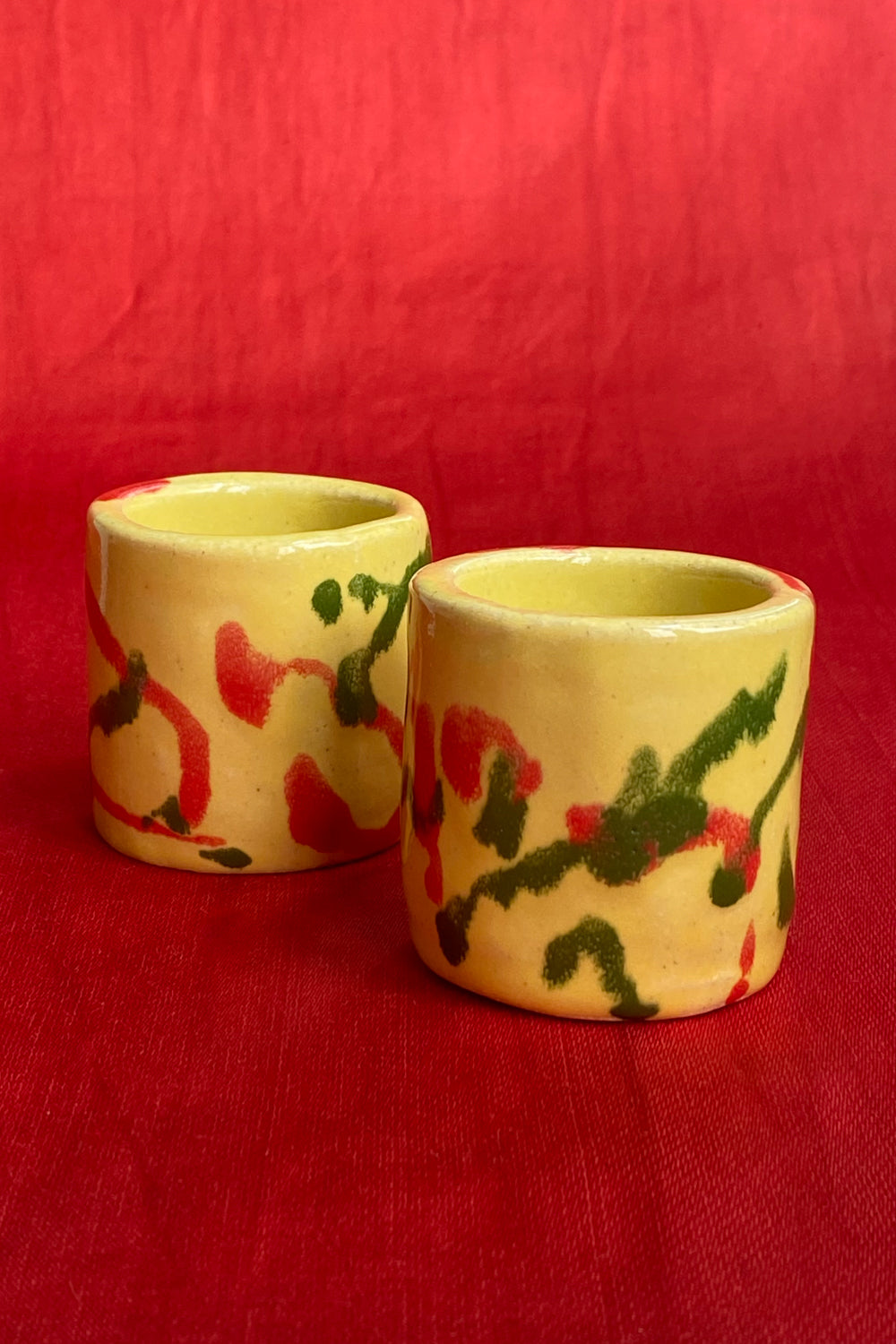 ceramic hand painted sipping tumblers in primaries