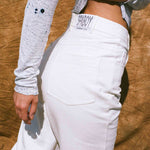 white cotton mid rise stovepipe cowboy jean