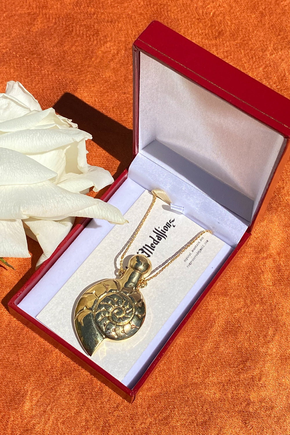 underwater relic spiral seashell brass medallion fragrance necklace