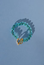 Load image into Gallery viewer, teal glass bead bracelet strung on silk thread