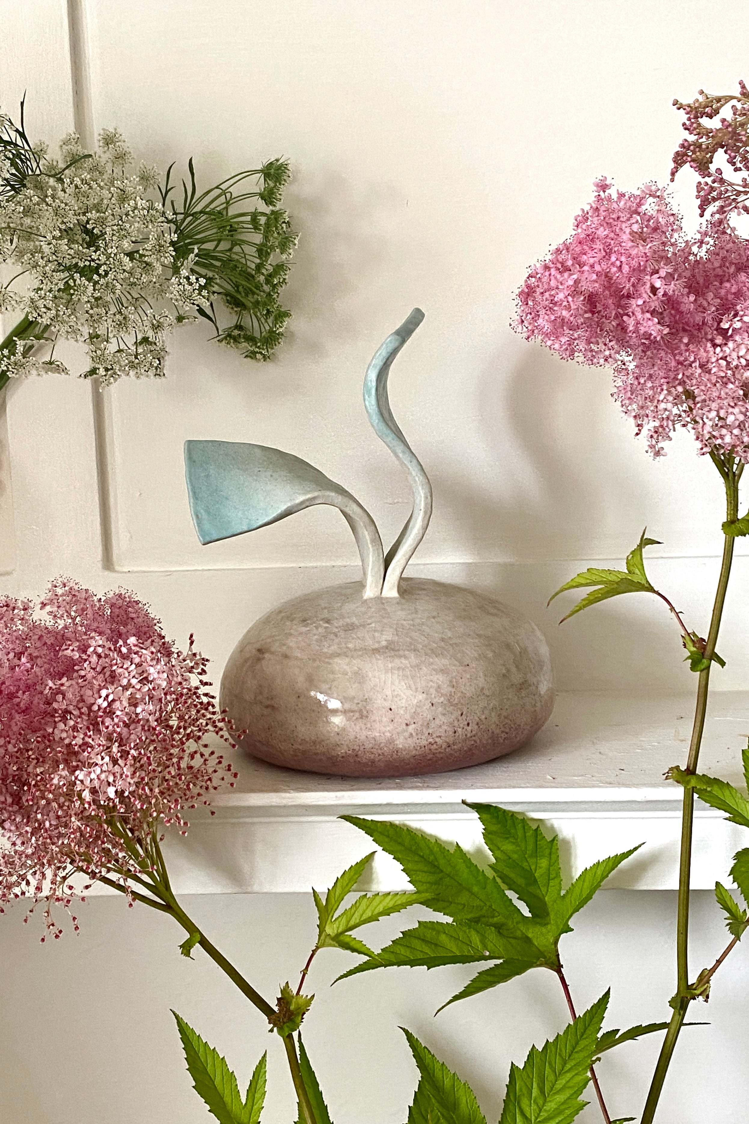 handmade ceramic daikon in pink brown and blue