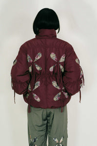 burgundy nylon winter jacket flower filled cutouts