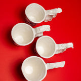 SCULPTURAL CUPS IN PORCELAIN WITH HAND PAINTED BIRDS