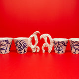 SCULPTURAL CUPS IN PORCELAIN WITH HAND PAINTED BIRDS