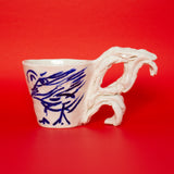 SCULPTURAL CUPS IN PORCELAIN WITH HAND PAINTED BIRDS