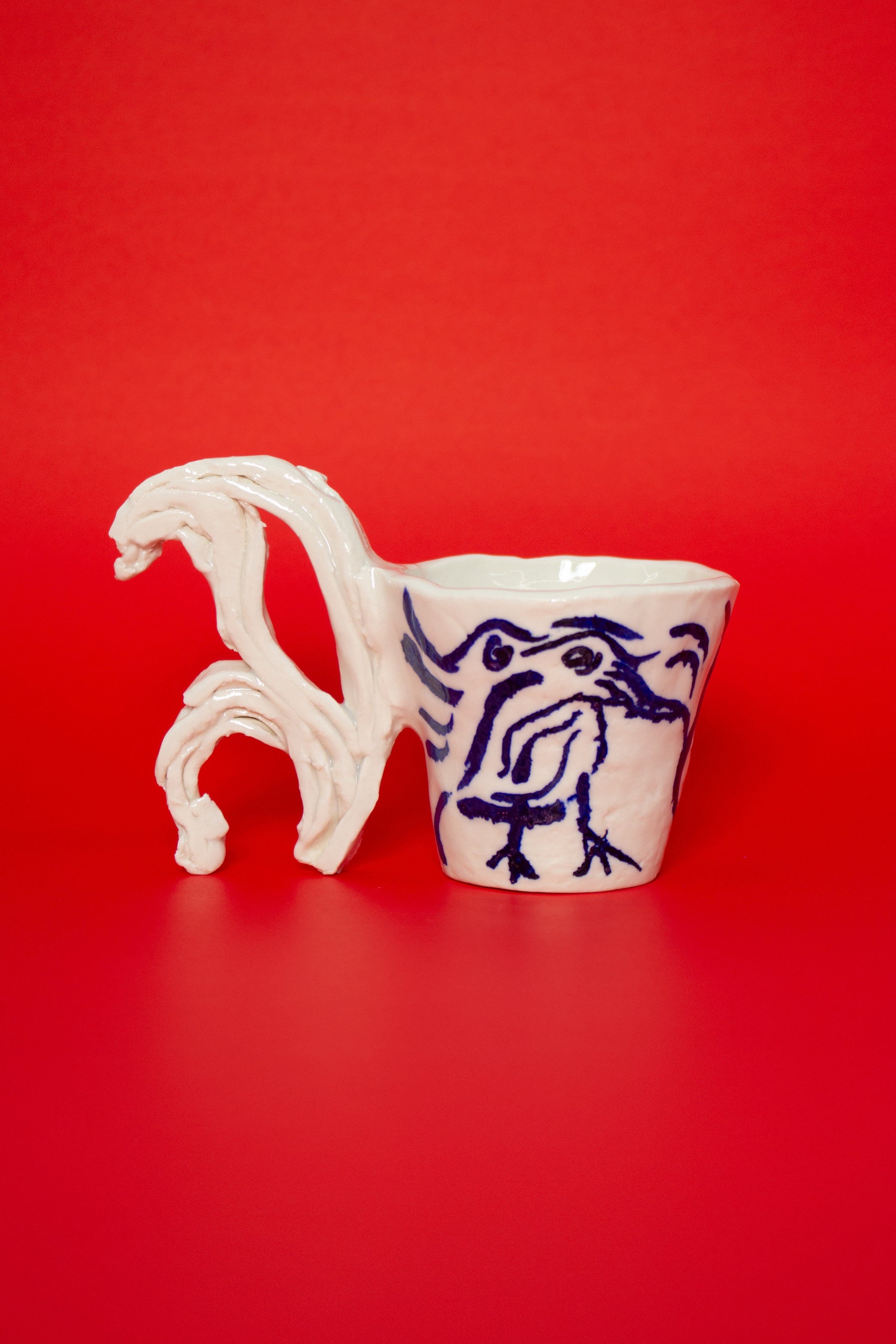 SCULPTURAL CUPS IN PORCELAIN WITH HAND PAINTED BIRDS
