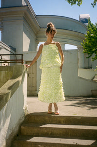 light yellow mid length ruffled skirt