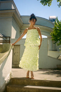 light yellow mid length ruffled skirt