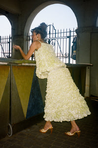 light yellow mid length ruffled skirt