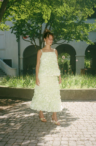 light yellow mid length ruffled skirt