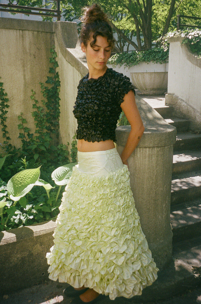 light yellow mid length ruffled skirt