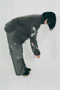 grey nylon polyester track pants petal cutout fabric underneath