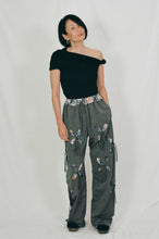 Load image into Gallery viewer, grey nylon polyester track pants petal cutout fabric underneath