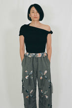 Load image into Gallery viewer, grey nylon polyester track pants petal cutout fabric underneath