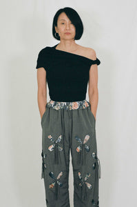 grey nylon polyester track pants petal cutout fabric underneath