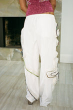 Load image into Gallery viewer, white straight leg nylon pants with floral appliqués