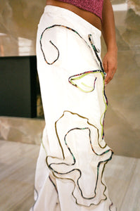 white straight leg nylon pants with floral appliqués