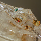 ENERO RING IN GOLD/GARNET