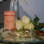 Parisian perfume glass bottle gold seashell topper