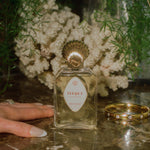 Parisian perfume glass bottle gold seashell topper