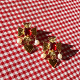 plated brass cross earrings with heart pearl drop