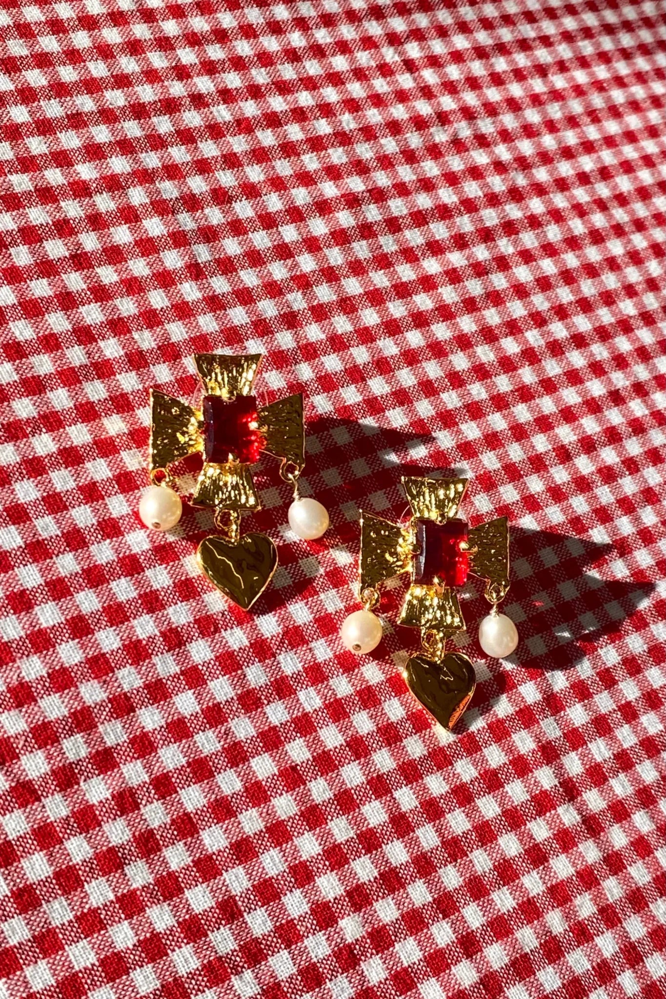 plated brass cross earrings with heart pearl drop