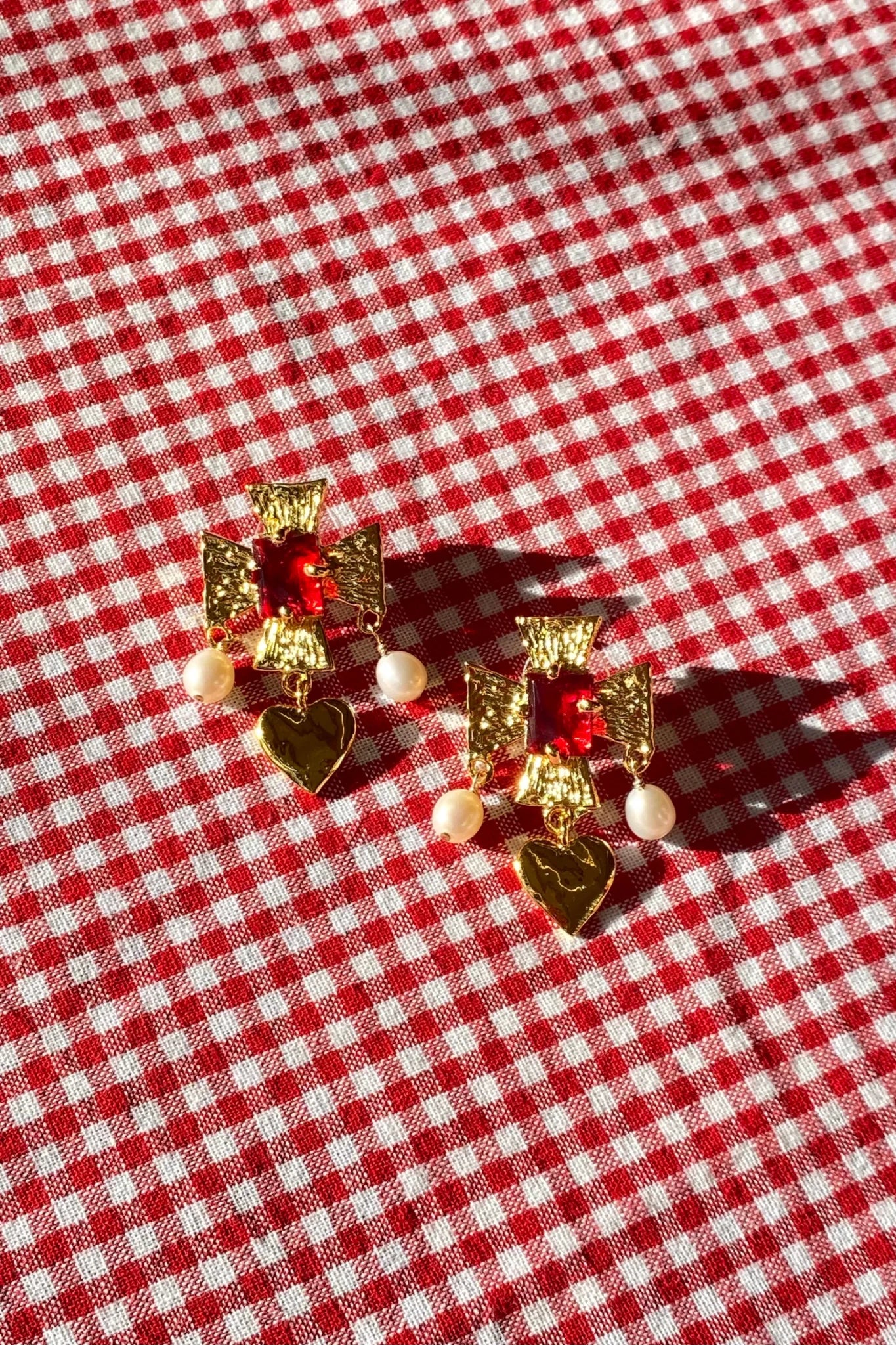 plated brass cross earrings with heart pearl drop