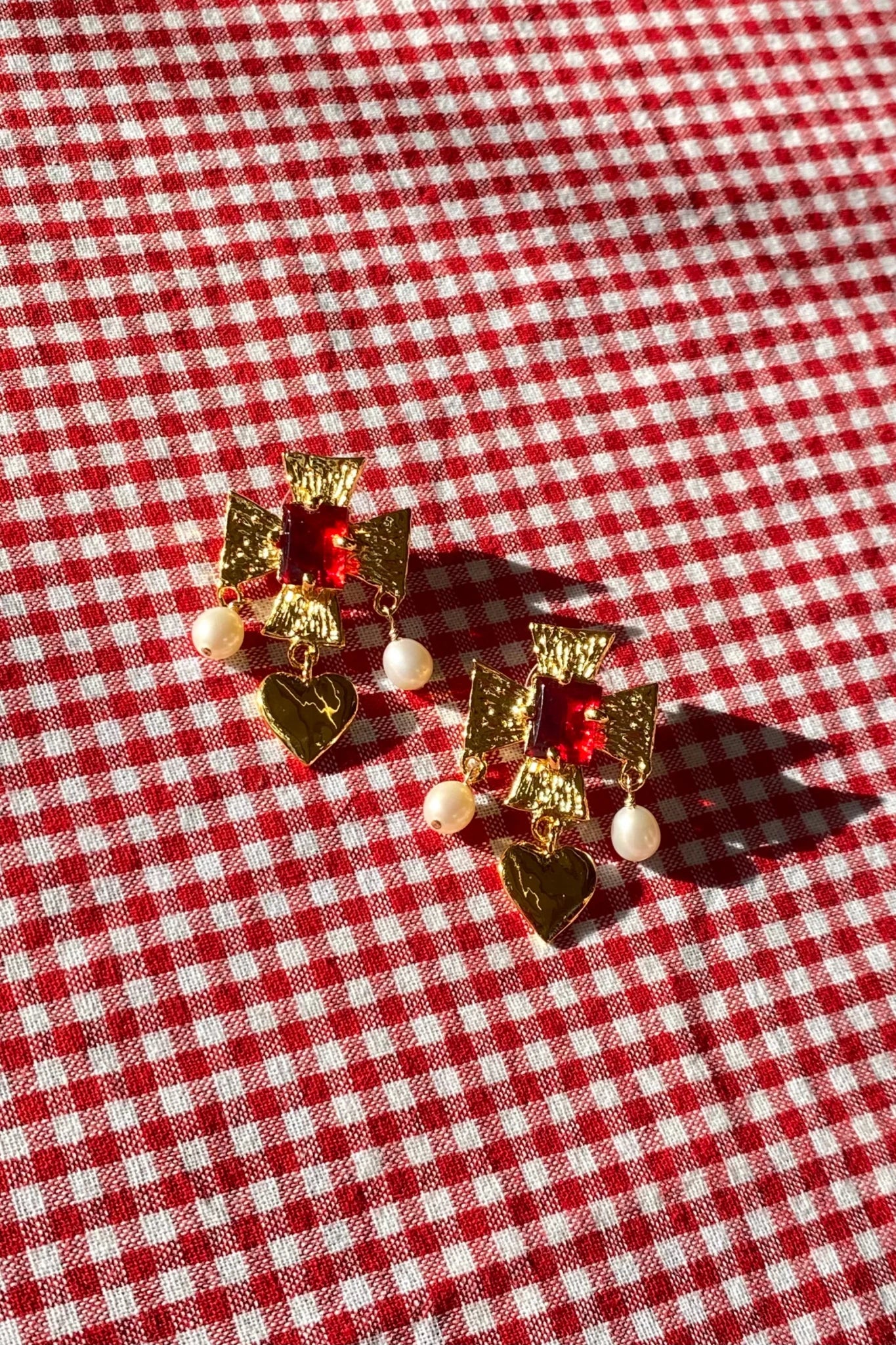 plated brass cross earrings with heart pearl drop