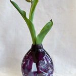 purple handblown glass vase with white patterns