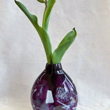 purple handblown glass vase with white patterns