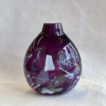 purple handblown glass vase with white patterns