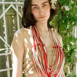 DRAPED BEADED BELT IN WHITE ON RED