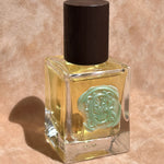 yellow perfume clear glass bottle wax stamped