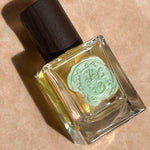 yellow perfume clear glass bottle wax stamped