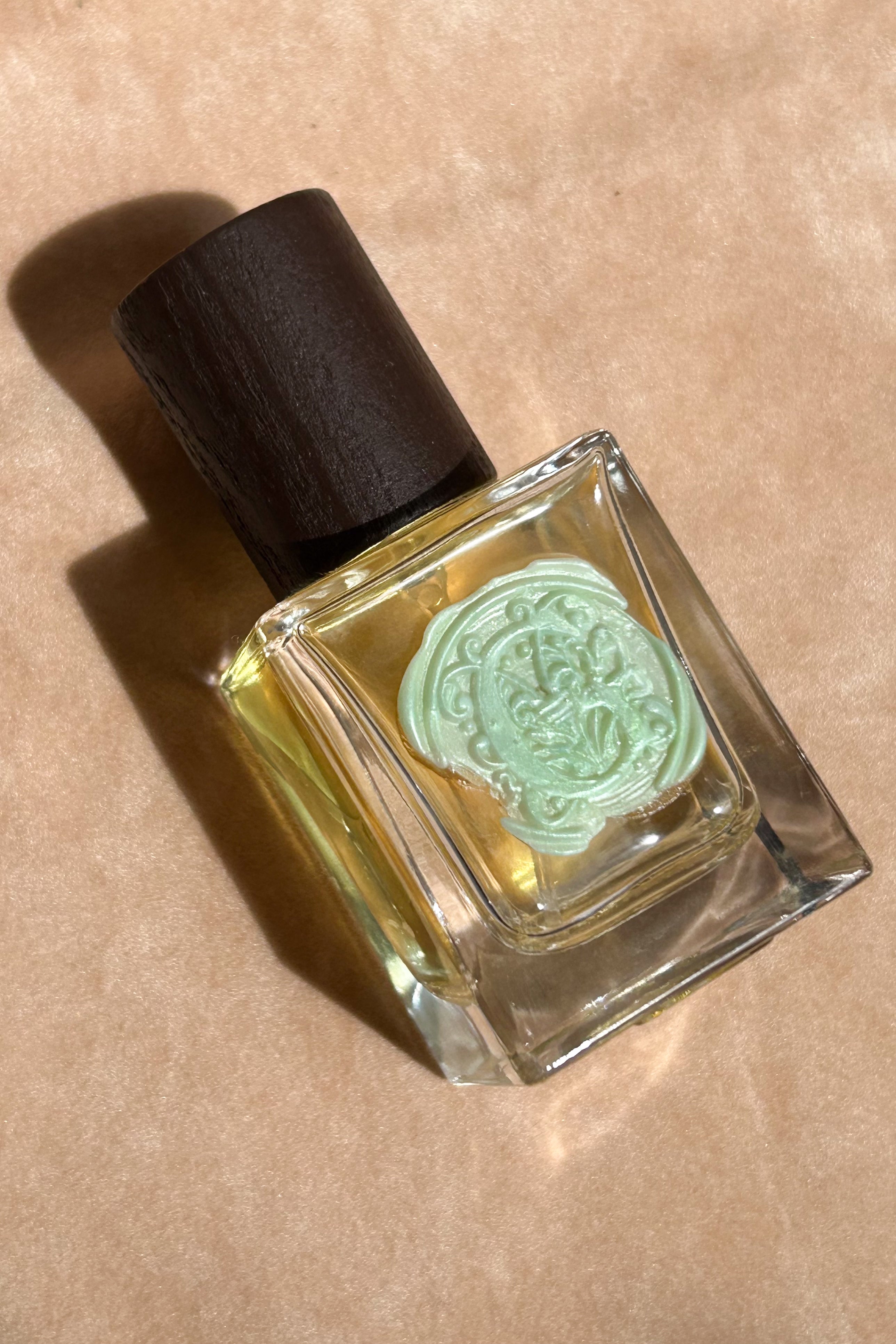 yellow perfume clear glass bottle wax stamped