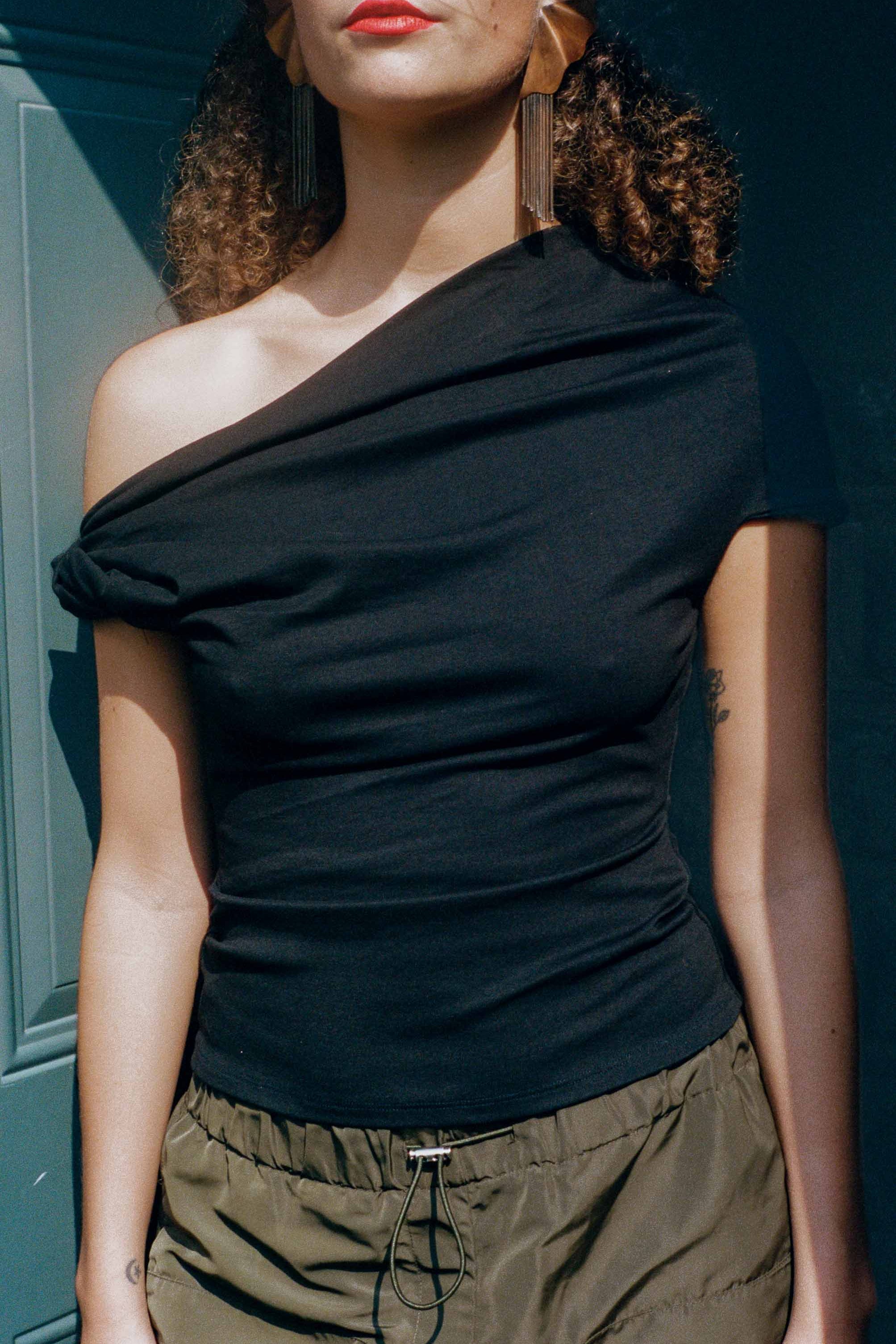 black cupro fitted off shoulder twist top