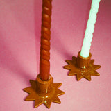 handmade star shaped glazed ceramic candleholders in brown
