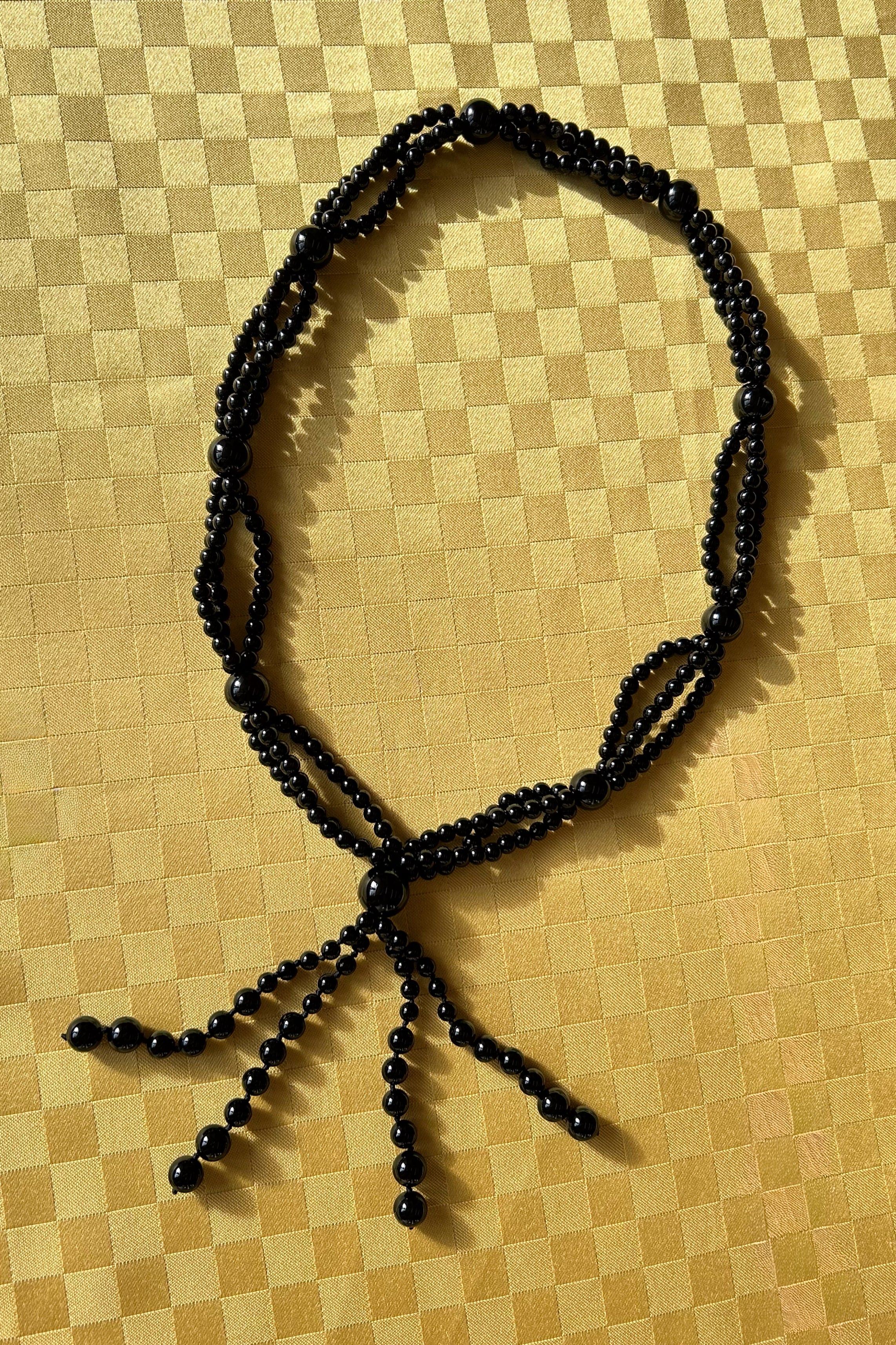 onyx gemstone circular knotted long tassel necklace