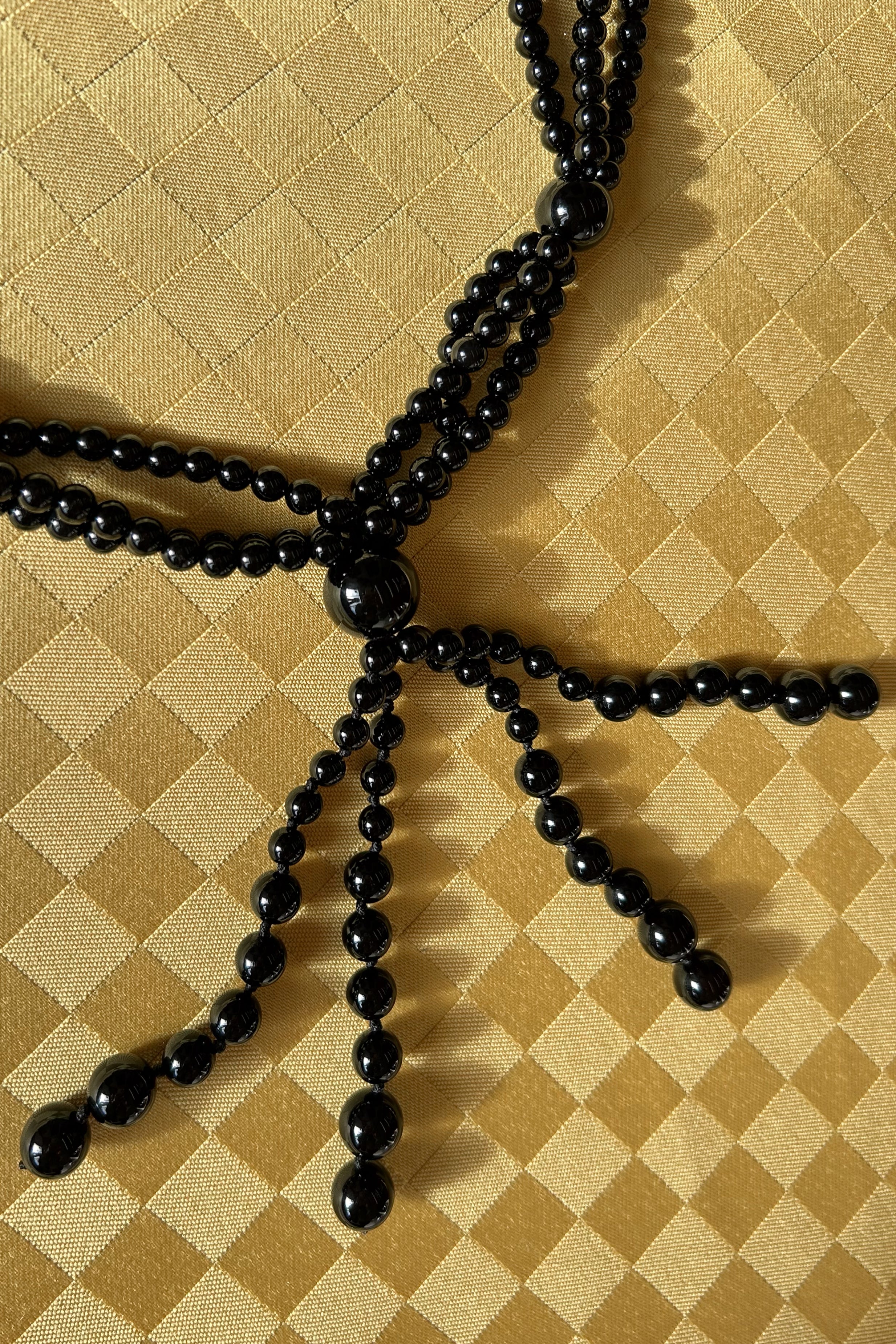 onyx gemstone circular knotted long tassel necklace