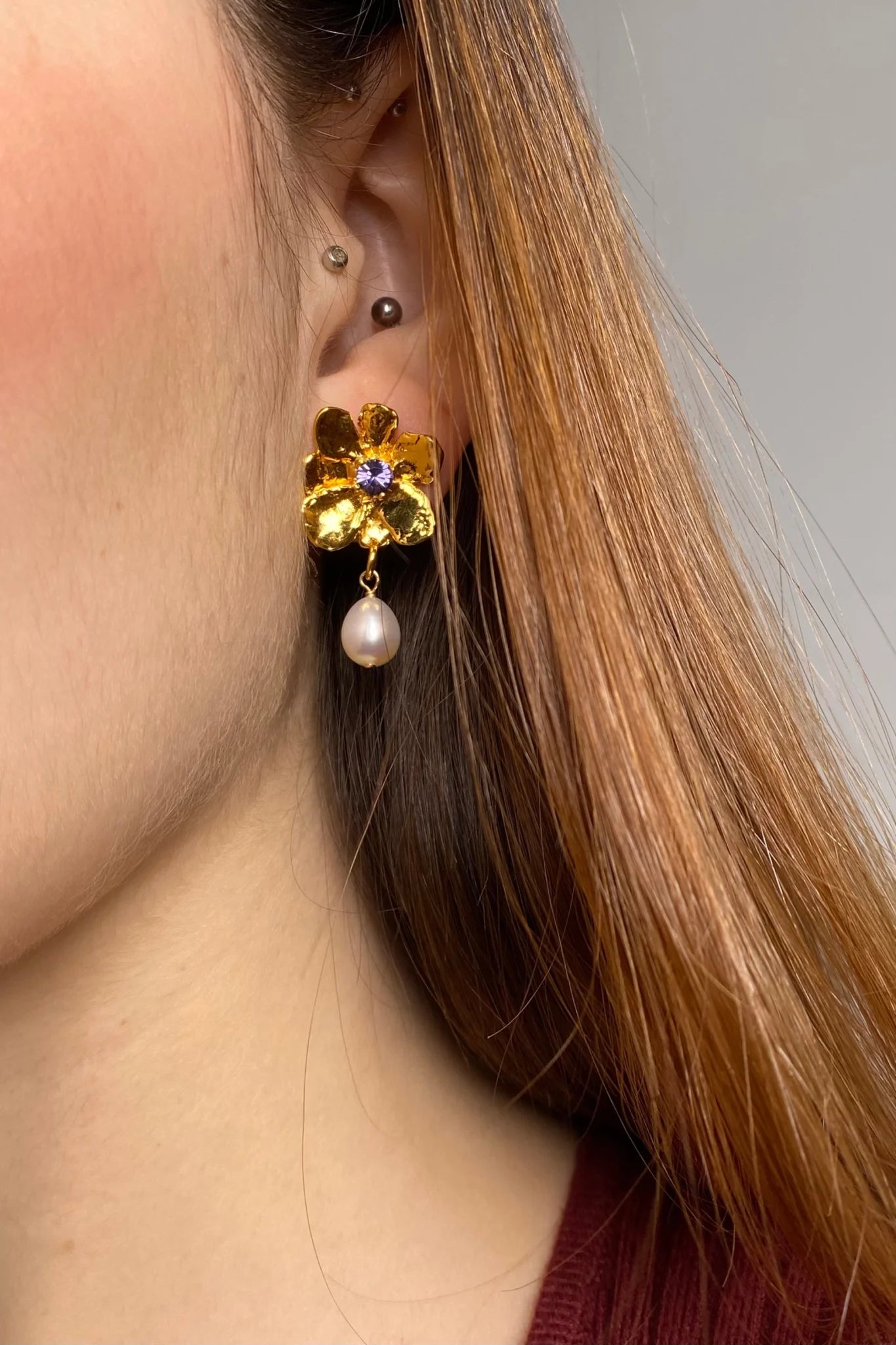 Gold plated flower earrings with violet stone pearl